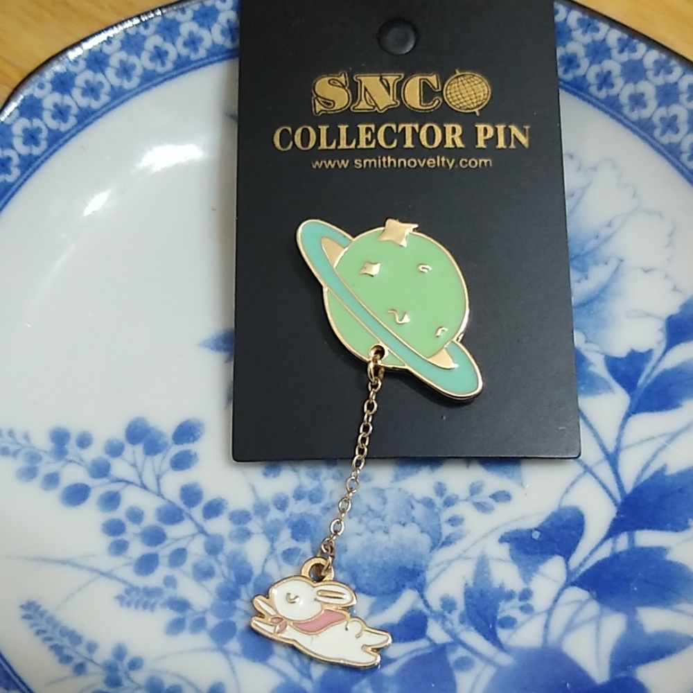 Bunny orbit gold toned pin